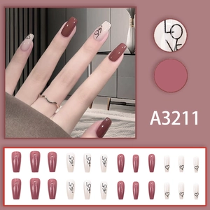 Pink and creamy white press-on nails with heart patterns and LOVE lettering design