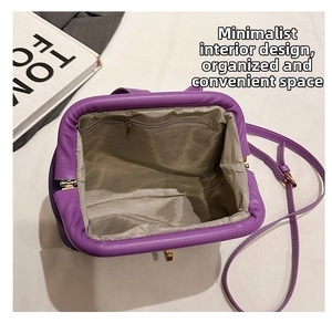 Interior view of purple cloud shell bag showing spacious compartment and zipper pocket