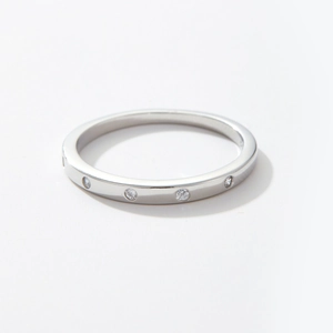 Detailed close-up of S925 sterling silver ring with small inset round clear diamonds