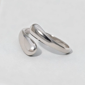 Minimalist silver teardrop open ring with polished finish and adjustable wrap design