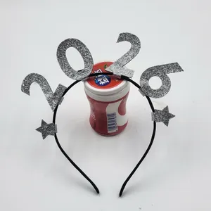 Close-up of 2026 New Year headband featuring silver sequined numbers and star details
