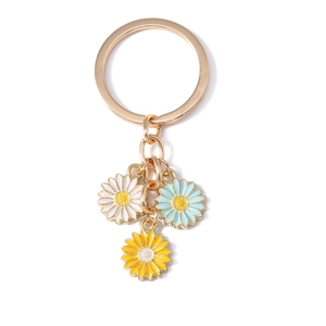 Sweet daisy keychain with white, blue, and yellow enamel flowers and golden metal ring