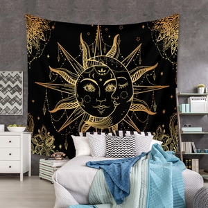 Macro detail of sun and moon mandala tapestry hanging on a bedroom wall decoration