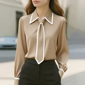 Detail of khaki commuter blouse with white contrast piping and matching necktie