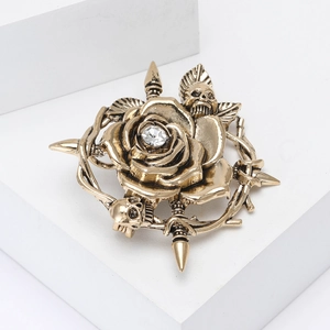 Vintage bronze alloy skeleton rose brooch with central crystal for women suits