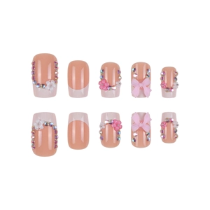 French tip press-on nails with 3D pink bows, white flowers and rhinestones