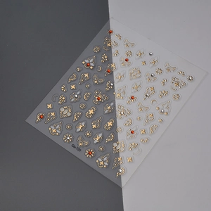 Detailed view of Co-131 gold mandala nail art stickers with embossed stars and moons