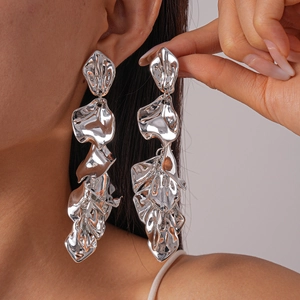 Exaggerated silver metallic flower petal drop earrings for women with a polished finish
