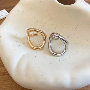 Minimalist fluid geometric open rings in polished gold and silver metal finishes
