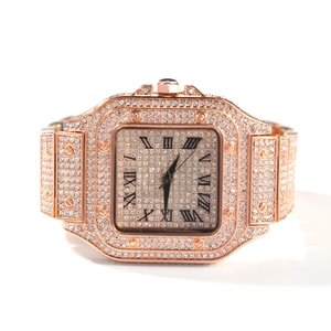 Macro detail of rose gold iced-out square watch featuring Roman numerals and crystals