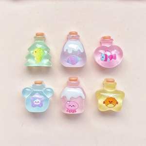 Detailed grid of colorful mini resin wish bottles with corks and sea creature fillers