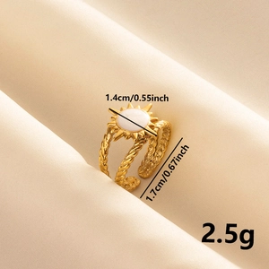 Macro view of 18k gold plated sun ring dimensions and weight on soft fabric