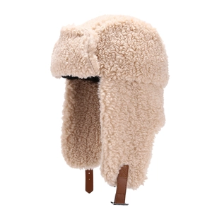 Winter beige faux lamb wool trapper hat with ear flaps and leather buckle strap