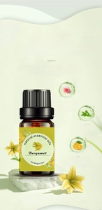 10ml bergamot essential oil bottle displayed on stone base with floral accents