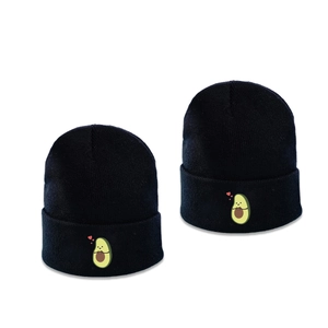 Minimalist black knitted beanie hat with a cute embroidered avocado and red heart pattern