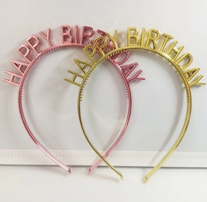 Detail view of pink and gold Happy Birthday headbands with vibrant metallic finish