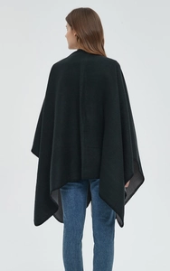 Close-up of the professional overlock edge stitching on a black cashmere-like shawl