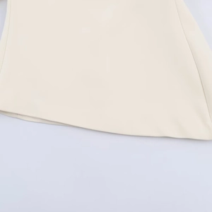 Close-up of stylish puff short sleeve top in cream white with high-quality woven fabric