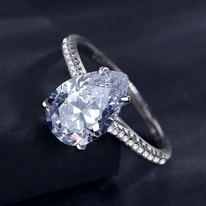 Luxurious 925 silver ring featuring a 3-carat pear-cut faux diamond and pavé side stones