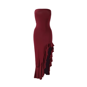 Detail of burgundy tube dress featuring high side slit and layered ruffle edges