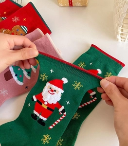 Detailed view of elastic feather yarn fabric with festive Santa Claus jacquard pattern