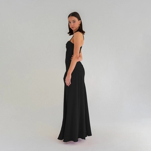 Elegant black strap evening gown with a slim fit and high slit for a sophisticated look