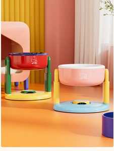 Detail of adjustable pet bowls showing vibrant color combinations and elevated floating design