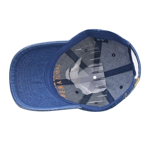 Internal view of washed denim baseball cap with sweatband and metallic buckle detail
