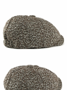 Vue macro détaillée du tissage en tweed texturé sur une casquette gavroche vintage