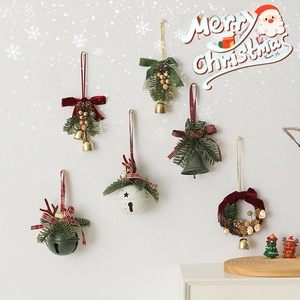 Christmas ornament set featuring pine cones, metal bells, and berries with velvet bows