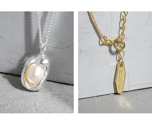 Detailed view of S925 sterling silver lobster clasp and organic baroque pearl pendant