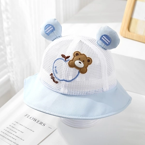 Close-up of baby sun hat with breathable mesh fabric and cute bear embroidery detail
