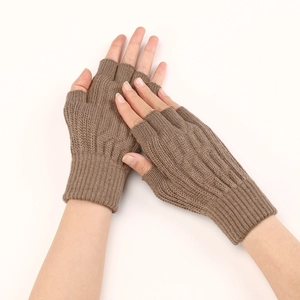 Detail of brown ribbed knit fingerless gloves with soft texture on a white background