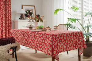 Macro view of red Christmas gingerbread man pattern on linen rectangular tablecloth