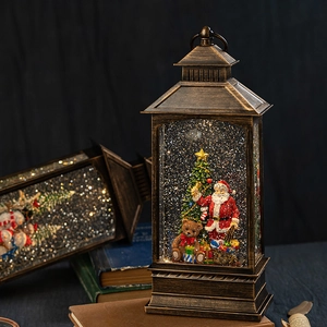 Vintage Christmas lantern music box with Santa and tree inside, warm lighting decoration