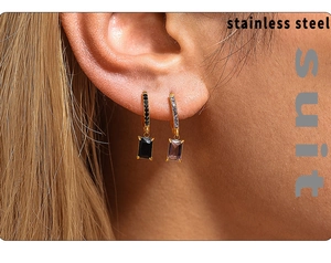 Close-up of model wearing gold square zircon drop earrings in black and purple colors