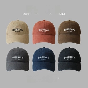 Detail of baseball caps in six colors featuring Brooklyn Est 1631 vintage embroidery