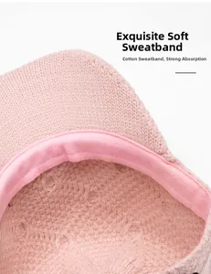 Detail of the soft cotton sweatband inside the pink knitted baseball cap for comfort