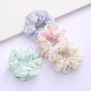 4-pack of French floral tulle scrunchies in pastel purple, pink, white, and green tones