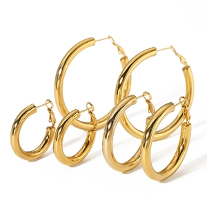 Detailed view of three pairs of hollow 18K gold plated stainless steel hoop earrings