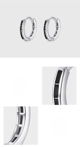 Detailed macro view of S925 sterling silver earrings with three black zircon stones