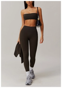 Detail of espresso brown yoga set with high-waist leggings and cropped tube top fabric