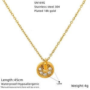 Detail of 18k gold plated stainless steel necklace with sparkling zircon round pendant