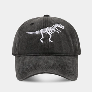 Close-up of dinosaur skeleton embroidery on washed cotton vintage baseball cap