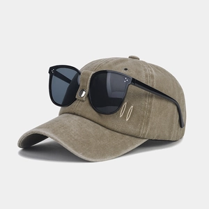 Detail view of retro khaki pilot baseball cap with integrated black square sunglasses