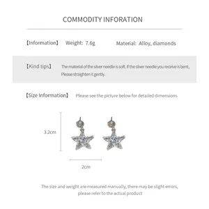 Detail view showing star-shaped diamond earrings with dimensions 3.2cm by 2cm and alloy texture