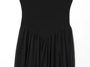 Detail of black dress featuring knit fabric spliced with pleated tulle mesh texture