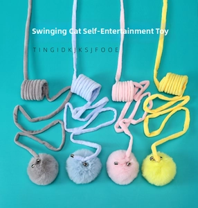 Detail of colorful hanging elastic cat toys with plush balls and bells for indoor play
