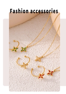 Detail of 18k gold plated clover jewelry set with zircon necklace and ear clips