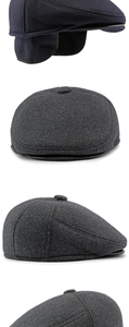 Detail view of dark grey winter newsboy hat with foldable ear flaps for extra warmth